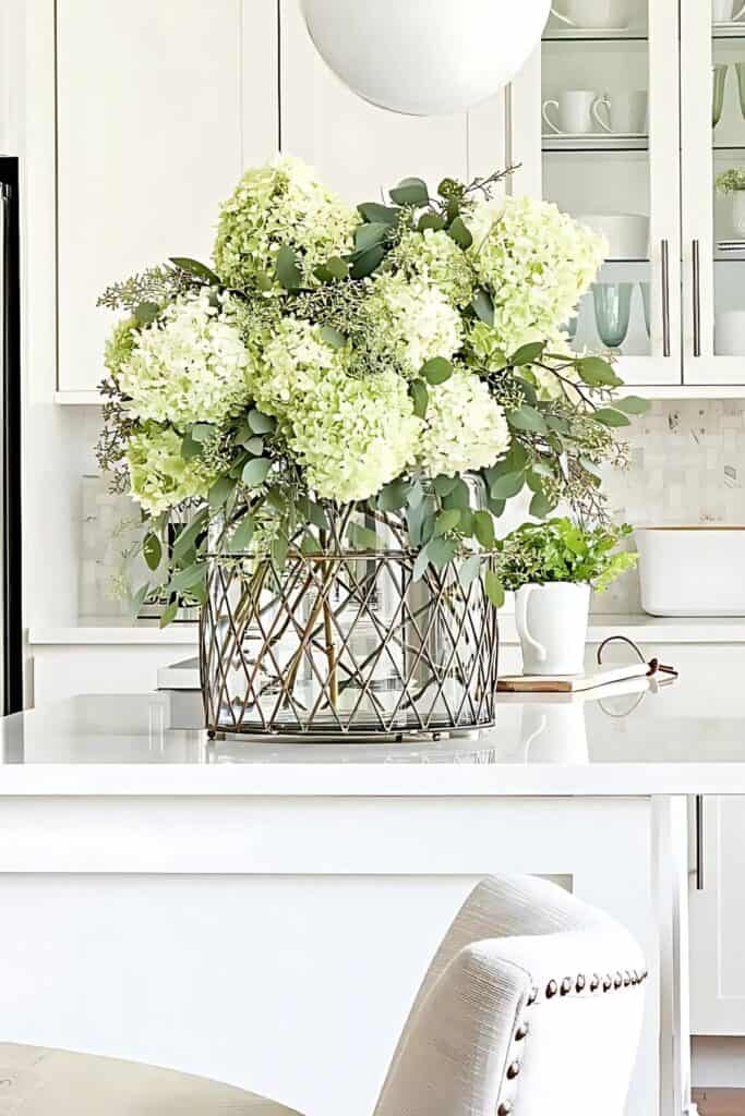1 DECORATING KITCHEN COUNTERTOPS-large container of hydrangeas as a focal point on a kitchen counter