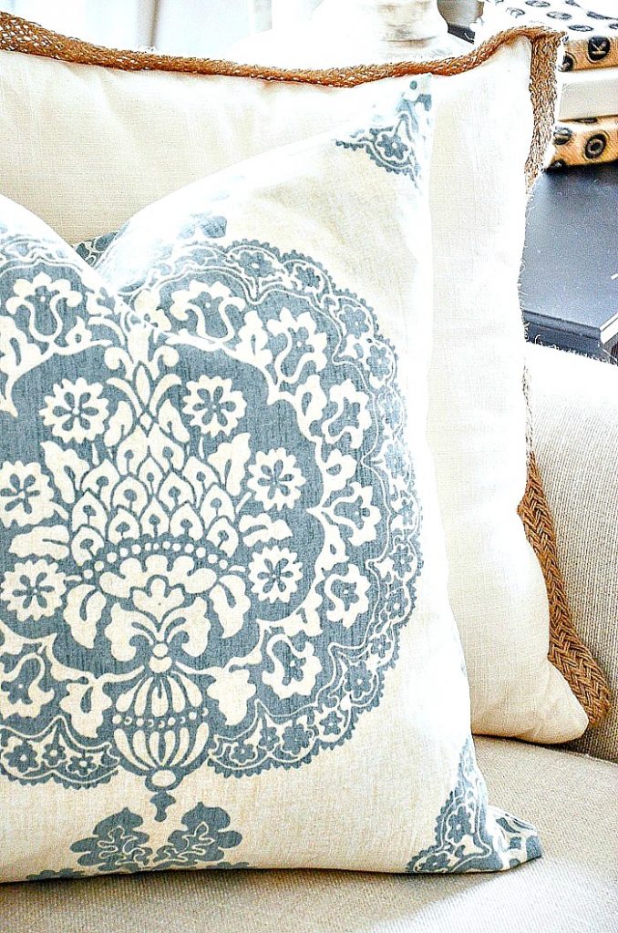 close up of a blue and white spring inspired pillow