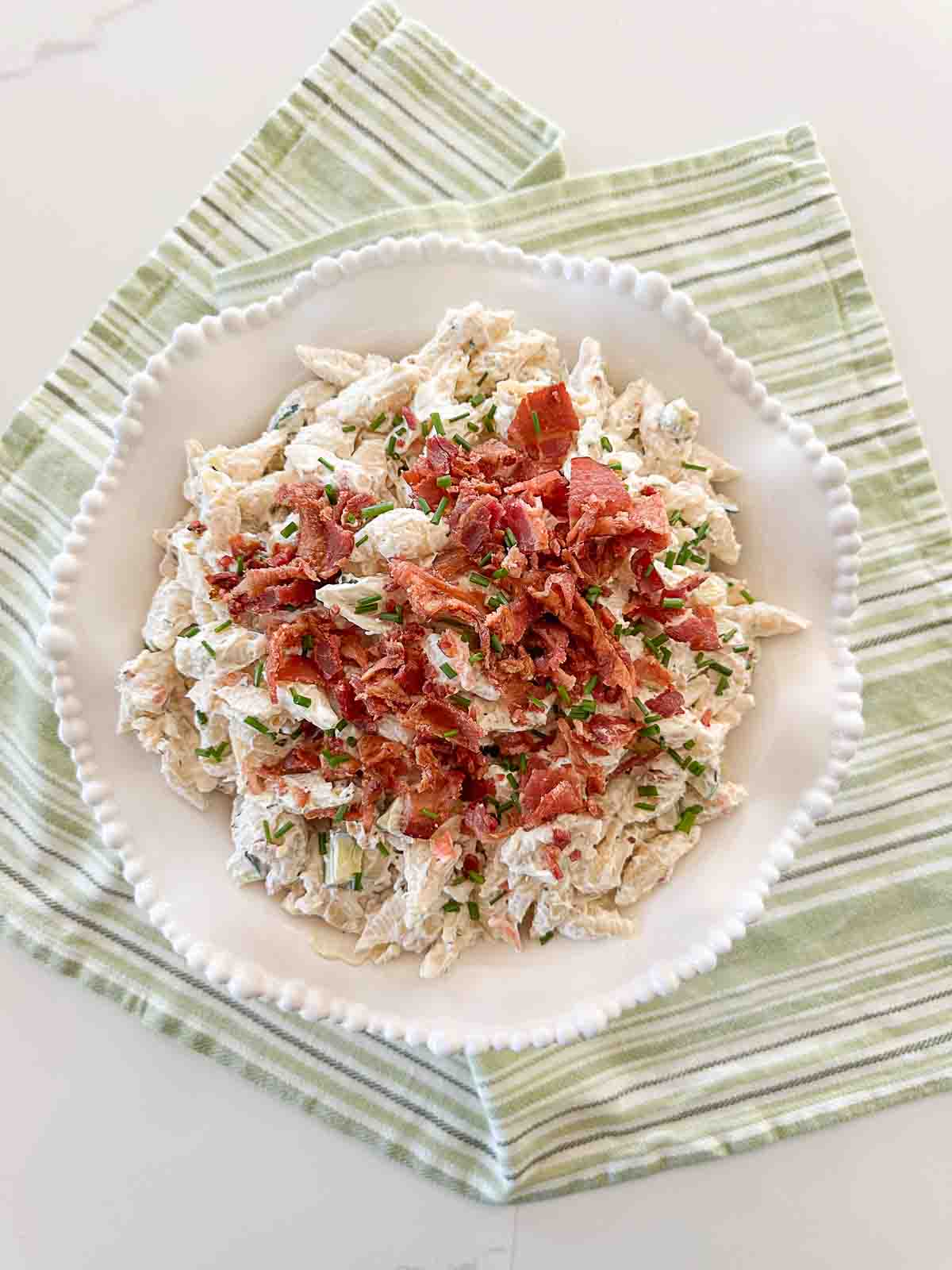 pasta salad in a white bowl