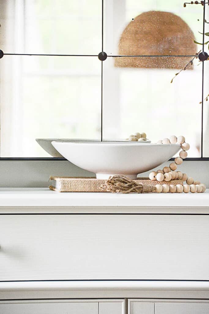 book as a riser for a white bowl