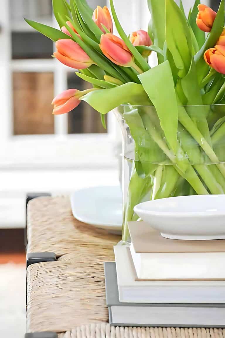 DECORATING WITH RISERS- stack of books as a riser on a coffee table