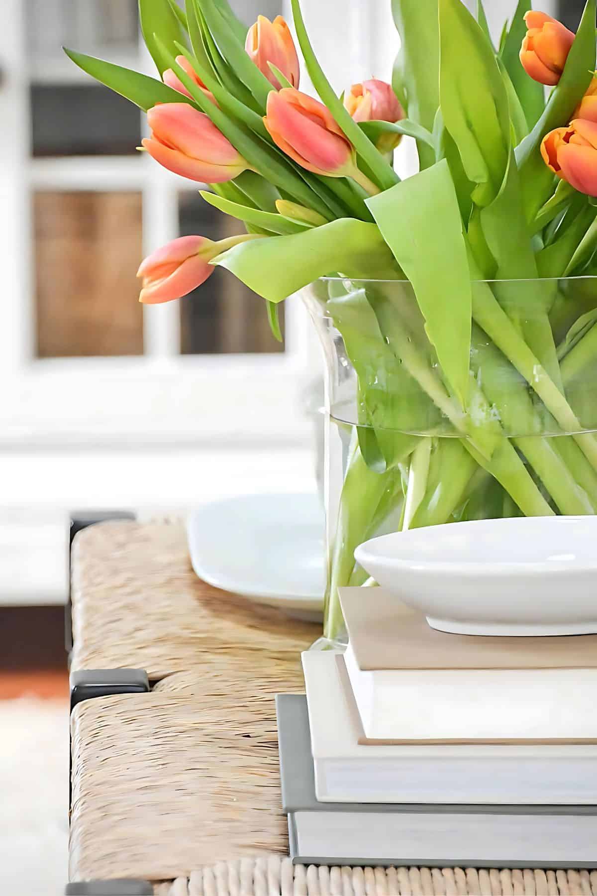 DECORATING WITH RISERS- stack of books as a riser on a coffee table