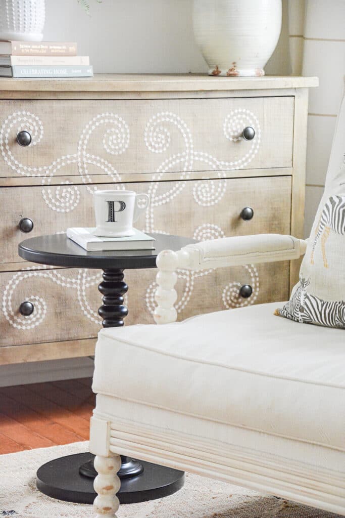 drink table next to a white spindle chair