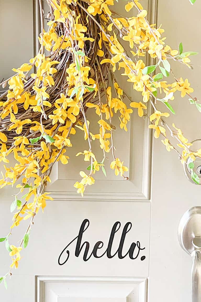 forsythia wreath on a front door