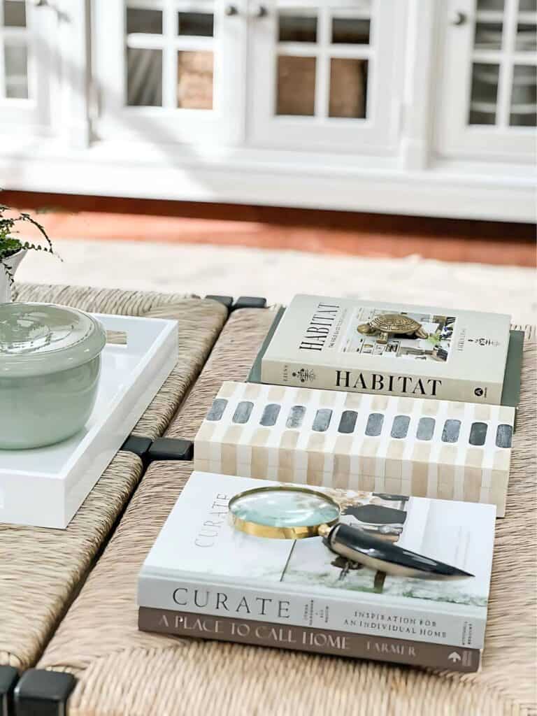 large coffee table-stacks of books on the coffee table