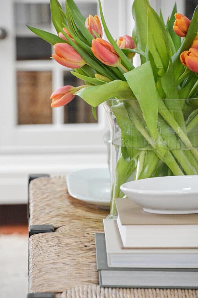 orange tulips on a coffee table