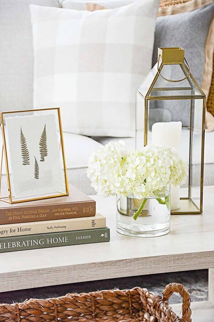STACK OF BOOKS ON A COFFEE TABLE